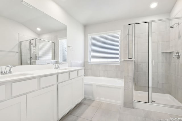 bathroom featuring lofted ceiling, vanity, tile patterned flooring, and plus walk in shower