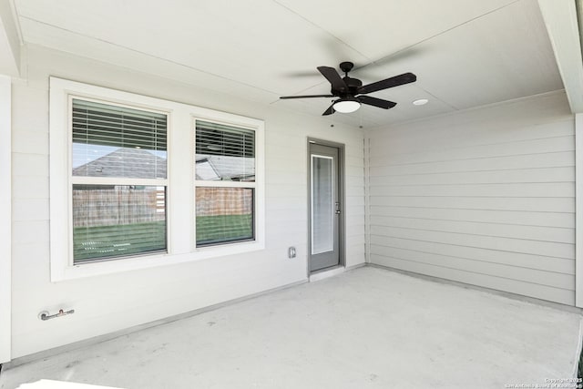 view of patio featuring ceiling fan