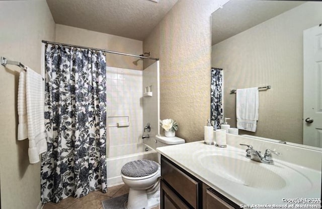 full bathroom with tile patterned flooring, vanity, shower / bath combination with curtain, a textured ceiling, and toilet