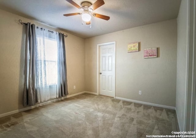 spare room with light carpet and ceiling fan