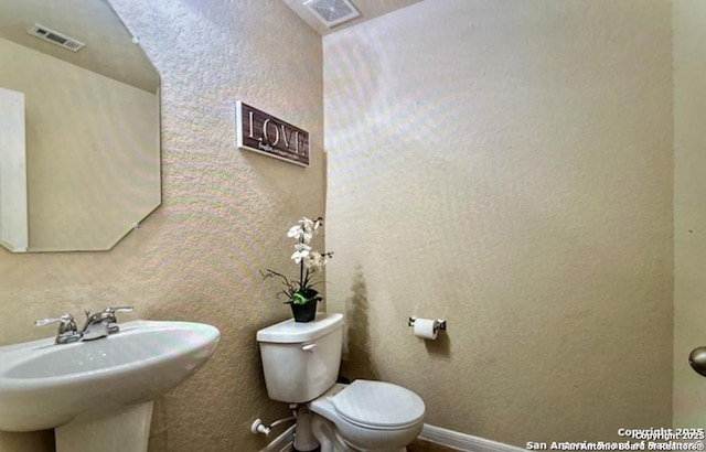 bathroom with sink and toilet