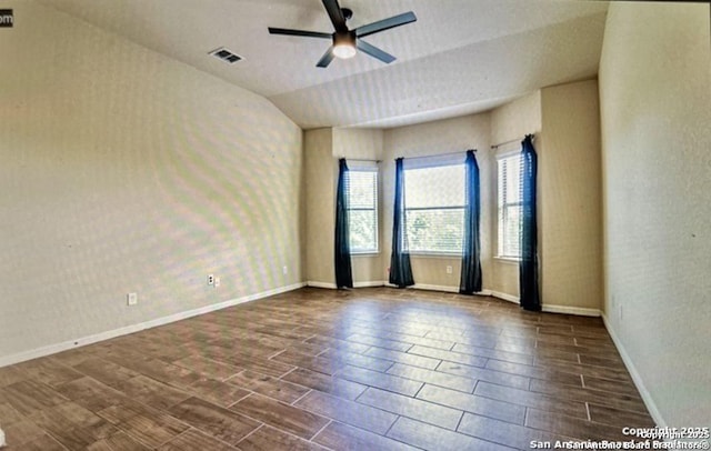 unfurnished room featuring vaulted ceiling and ceiling fan