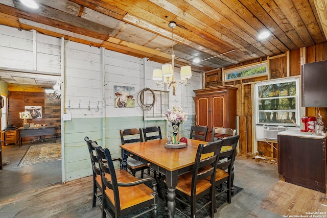 dining space featuring wood walls, wood ceiling, a chandelier, dark hardwood / wood-style floors, and cooling unit