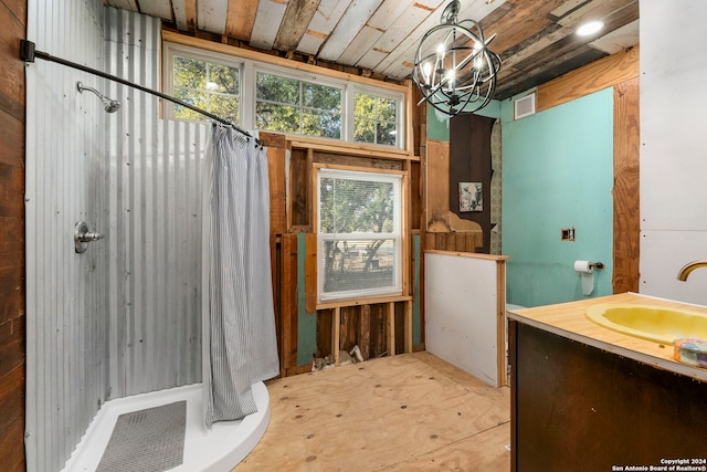 bathroom featuring vanity and a shower with shower curtain