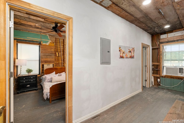 hall featuring cooling unit, dark hardwood / wood-style floors, and electric panel