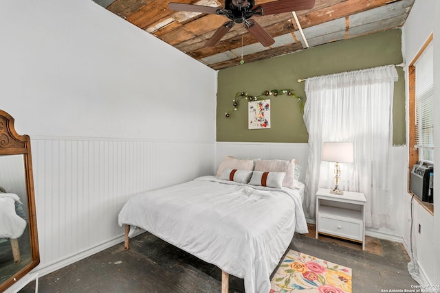 bedroom featuring vaulted ceiling, wooden ceiling, and ceiling fan