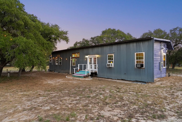 back house at dusk with french doors