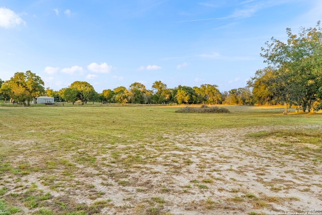 view of yard with a rural view