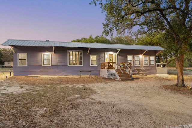 view of front of property featuring covered porch