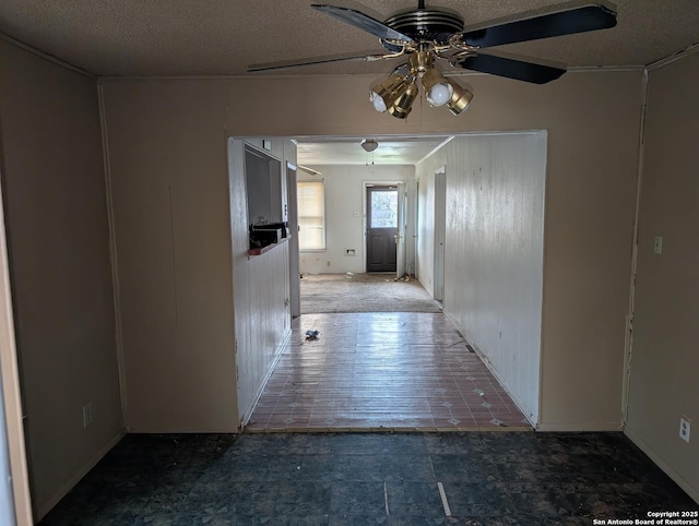 hallway featuring a textured ceiling