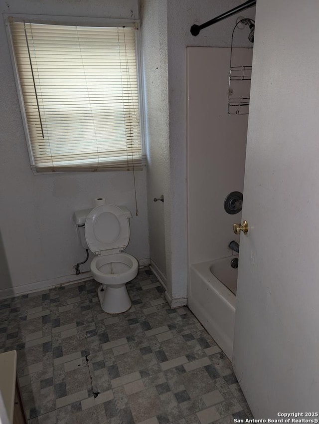 bathroom with shower / bathtub combination and toilet