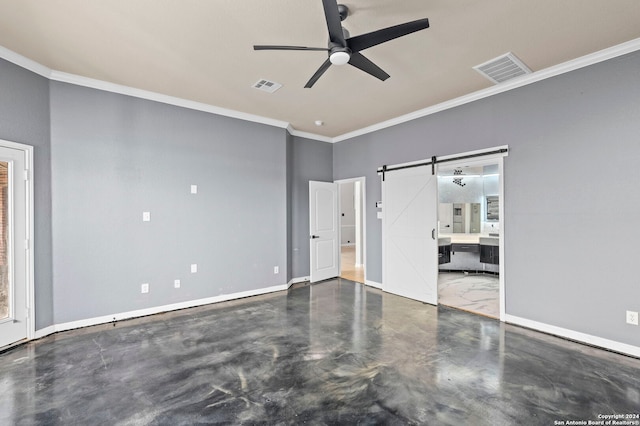 unfurnished bedroom featuring ornamental molding, a barn door, connected bathroom, and ceiling fan