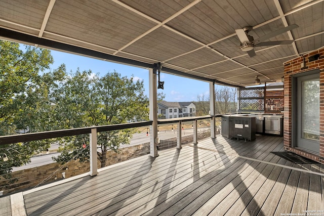 wooden deck featuring ceiling fan