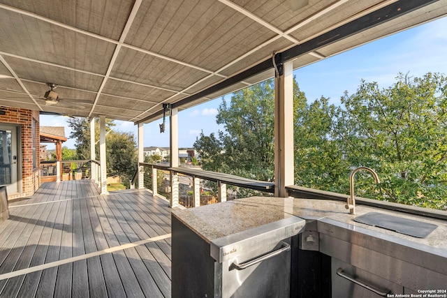 wooden deck with an outdoor bar