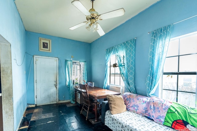 interior space with ceiling fan