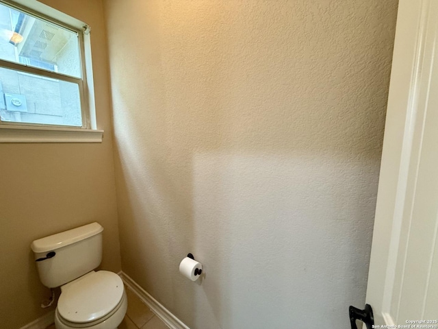 bathroom featuring toilet