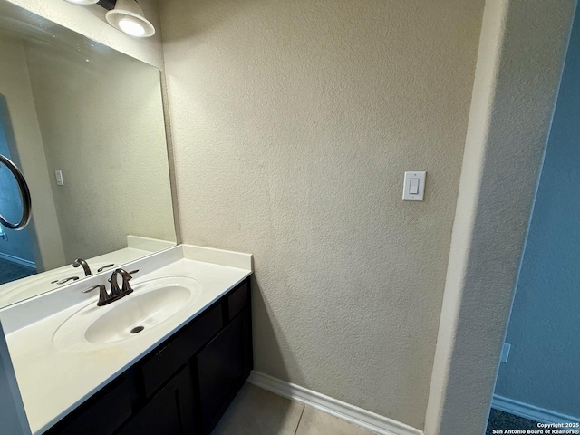 bathroom with tile patterned flooring and vanity