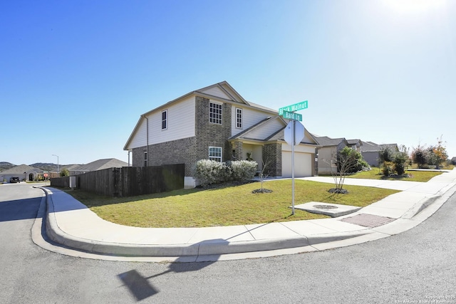 view of front property with a garage and a front lawn