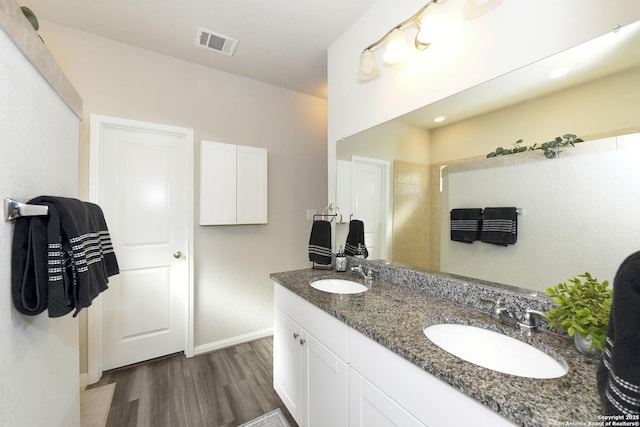 bathroom featuring vanity and hardwood / wood-style floors