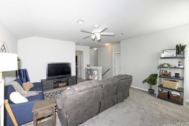 carpeted living room with lofted ceiling and ceiling fan