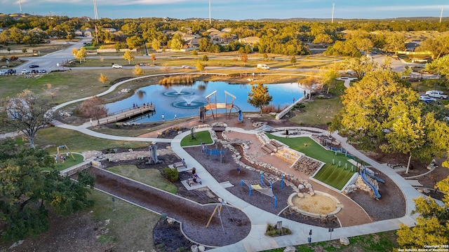 birds eye view of property with a water view