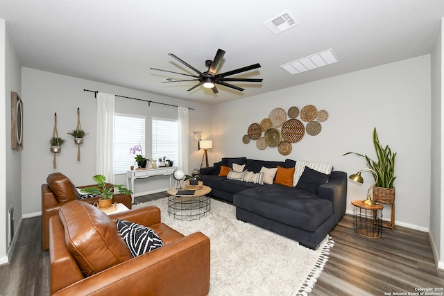 living room with hardwood / wood-style flooring and ceiling fan