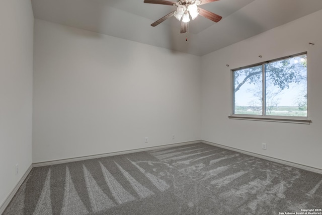 empty room featuring dark carpet and ceiling fan