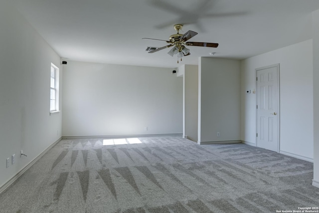 spare room with light carpet and ceiling fan