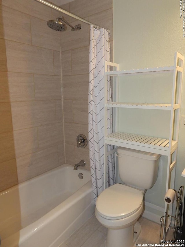 bathroom featuring shower / tub combo, toilet, and tile patterned flooring