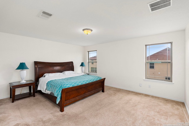 bedroom with light colored carpet