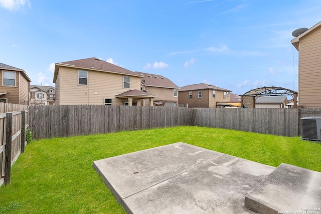 view of yard with a patio area and central air condition unit