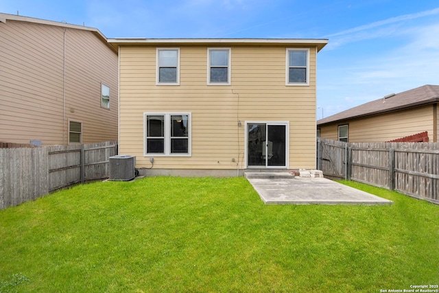 rear view of house with a yard, central AC unit, and a patio area