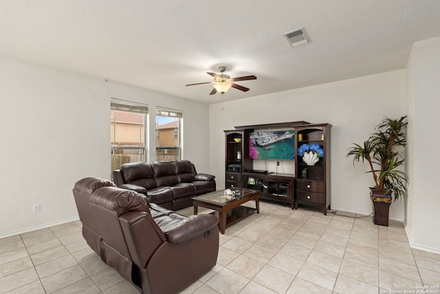 living room featuring light tile patterned floors and ceiling fan