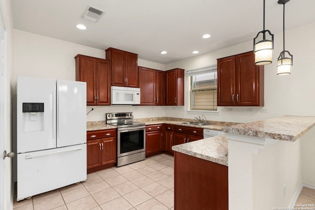 kitchen featuring decorative light fixtures, sink, light tile patterned floors, kitchen peninsula, and white appliances