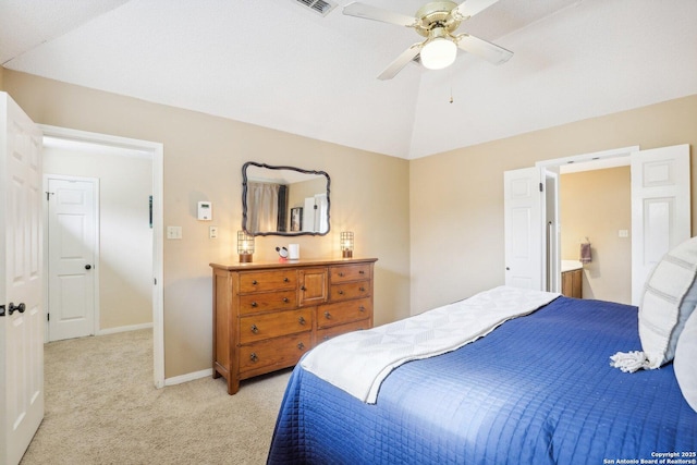 bedroom with ceiling fan, lofted ceiling, and light colored carpet