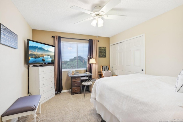 bedroom featuring a textured ceiling, a closet, and ceiling fan