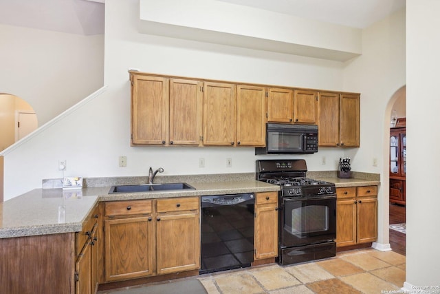 kitchen featuring sink and black appliances