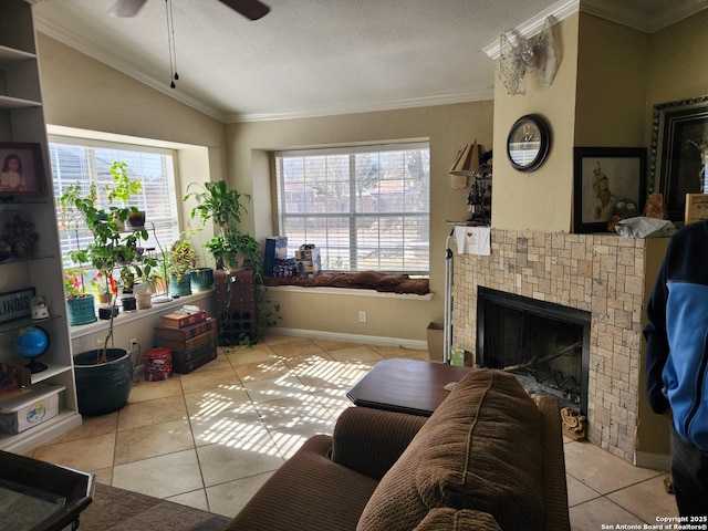 tiled living room with crown molding, ceiling fan, a fireplace, a textured ceiling, and vaulted ceiling