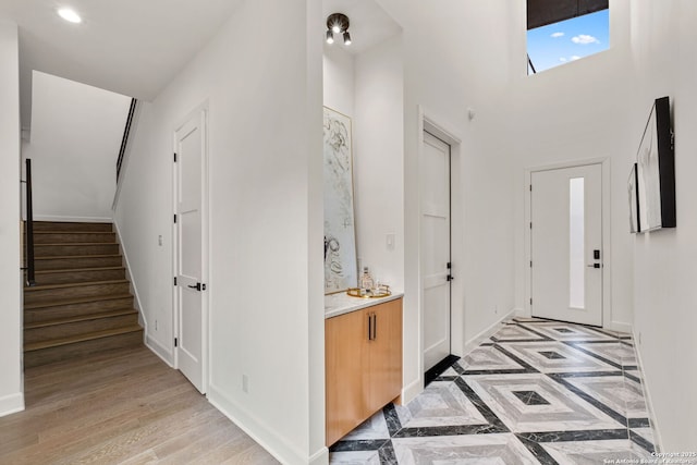 foyer entrance with light hardwood / wood-style floors