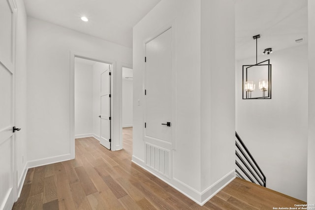 corridor featuring light hardwood / wood-style flooring