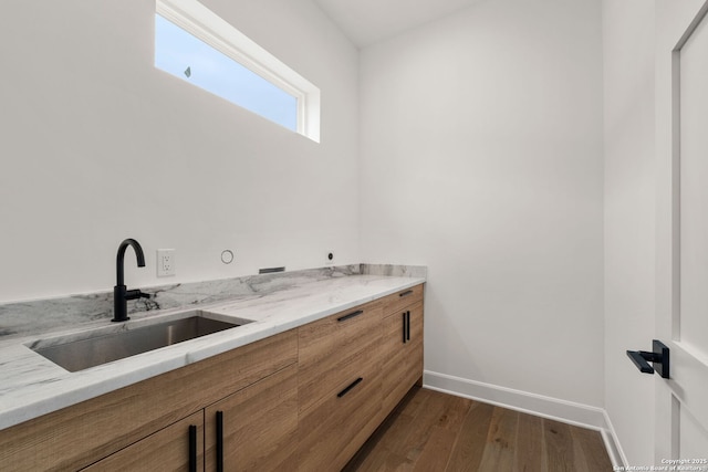 bathroom with sink and hardwood / wood-style floors