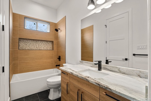 full bathroom with tiled shower / bath, vanity, toilet, and tile patterned flooring