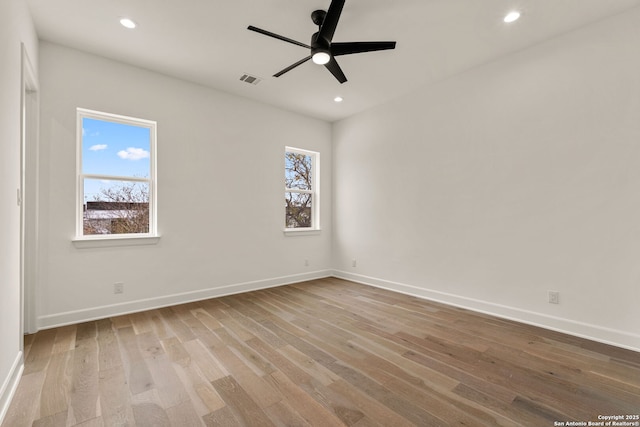 spare room with ceiling fan and light hardwood / wood-style floors