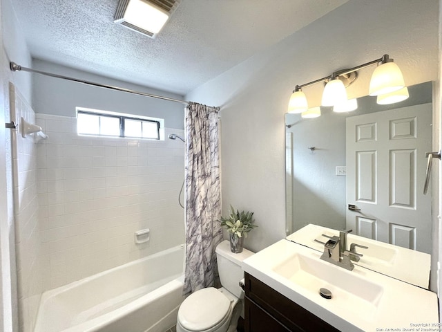 full bathroom with vanity, a textured ceiling, toilet, and shower / bath combo