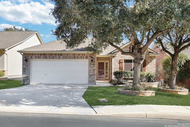 view of front of property featuring a garage and a front yard