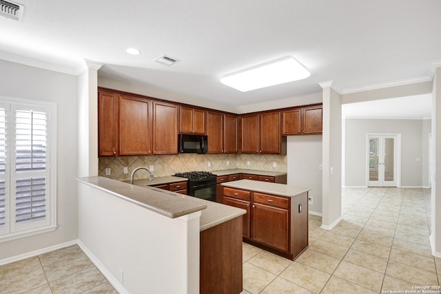 kitchen featuring crown molding, black appliances, kitchen peninsula, and light tile patterned flooring