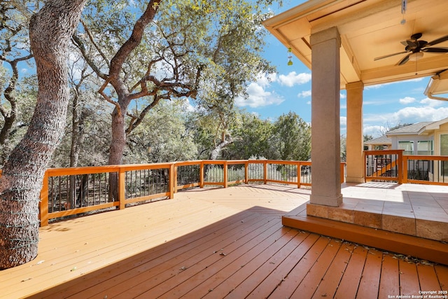 wooden deck featuring ceiling fan