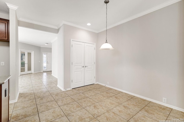 interior space with ornamental molding and light tile patterned floors