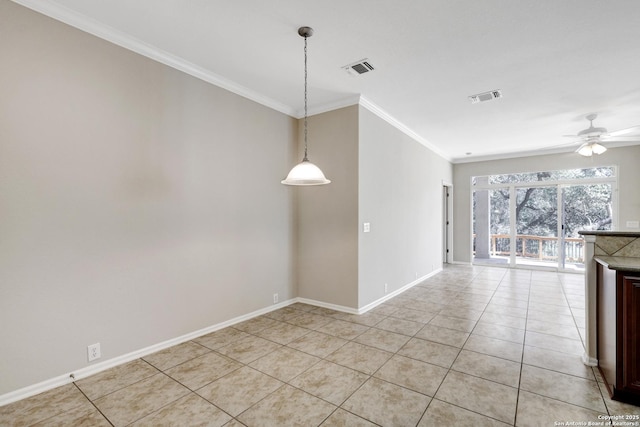 tiled spare room with crown molding and ceiling fan