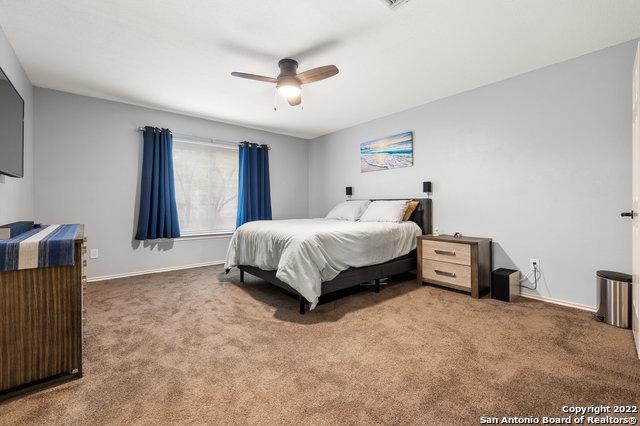 bedroom with carpet and ceiling fan